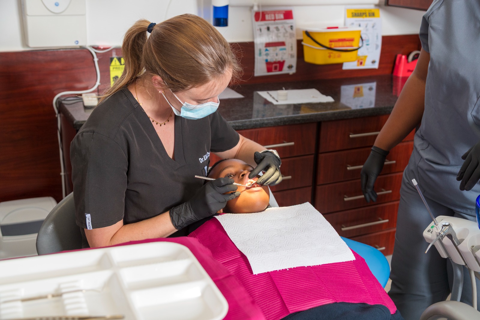 Dr Emily providing dental treatment at Medicross Kenilworth