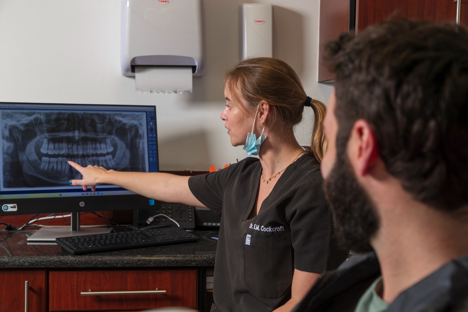 Dr Emily explaining a dental X-ray to a patient
